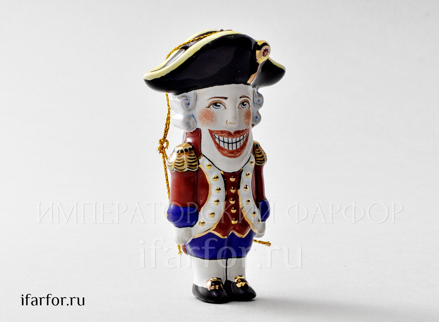 Елочная игрушка «Щелкунчик в шляпе» Форма: Щелкунчик в шляпе. Майолика. 60 x 100 мм.