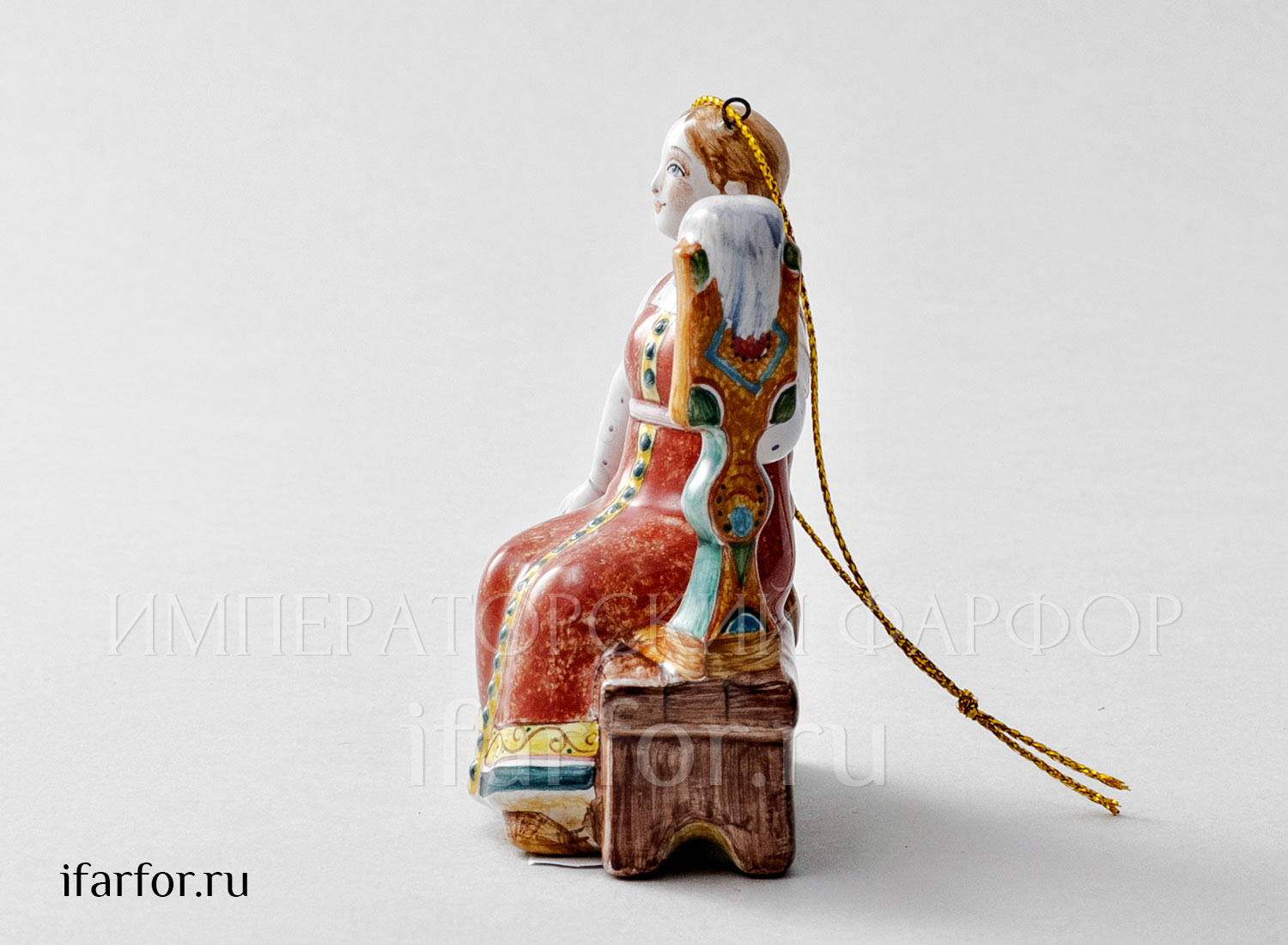Елочная игрушка «Пряха» Форма: Пряха. Майолика. 65 x 90 мм.