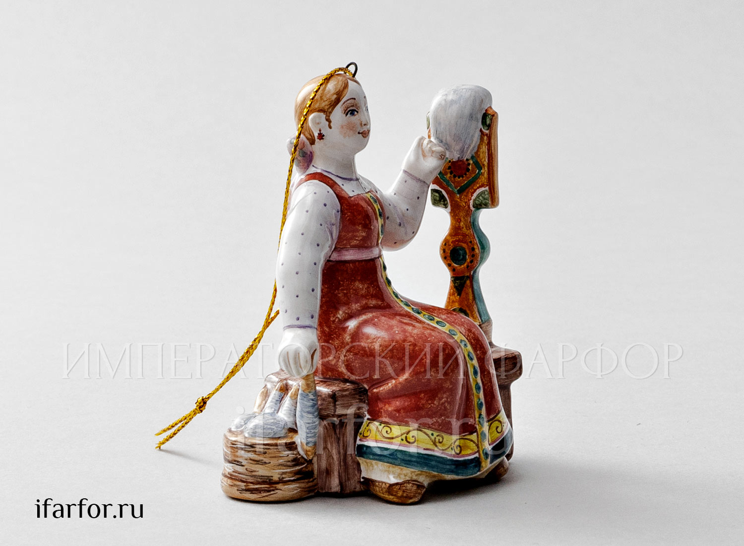Елочная игрушка «Пряха» Форма: Пряха. Майолика. 65 x 90 мм.